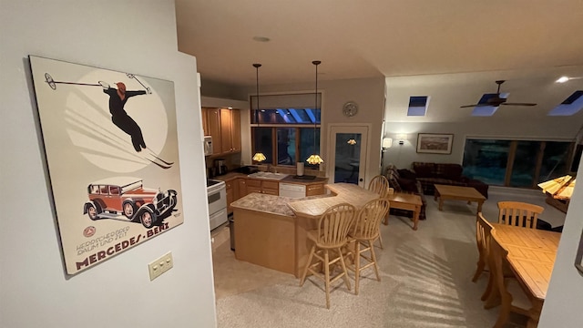 248 Club Sugarbush Ext Unit 18, Warren, VT 05674 - kitchen with white appliances, ceiling fan, a breakfast bar area, and light carpet