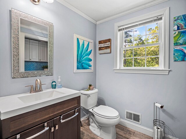 20 Lawrence Rd, Derry, NH 03038 - half bath with crown molding, healthy amount of natural light, vanity, and wood finished floors