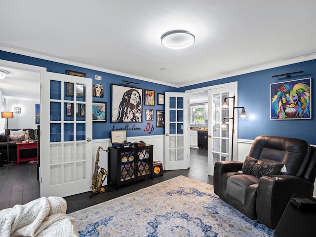 20 Lawrence Rd, Derry, NH 03038 - living room with french doors, wood finished floors, wainscoting, and ornamental molding
