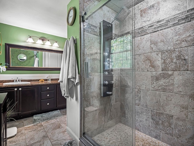 20 Lawrence Rd, Derry, NH 03038 - bathroom featuring vanity, a shower stall, and stone finish flooring