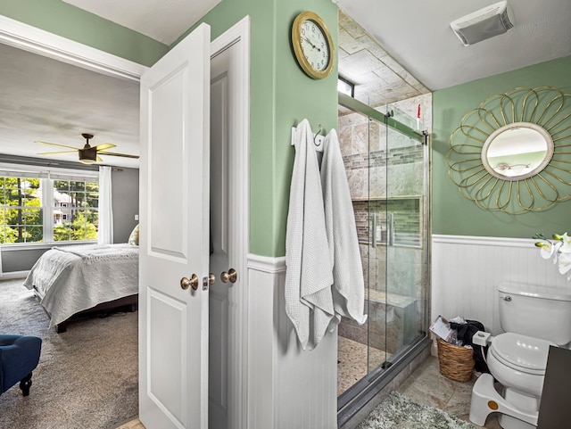 20 Lawrence Rd, Derry, NH 03038 - bathroom featuring a wainscoted wall, ensuite bath, a shower stall, and a ceiling fan