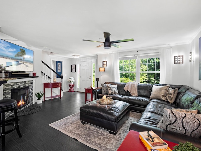 20 Lawrence Rd, Derry, NH 03038 - living room featuring ceiling fan, dark wood-type flooring, stairs, a tiled fireplace, and ornamental molding