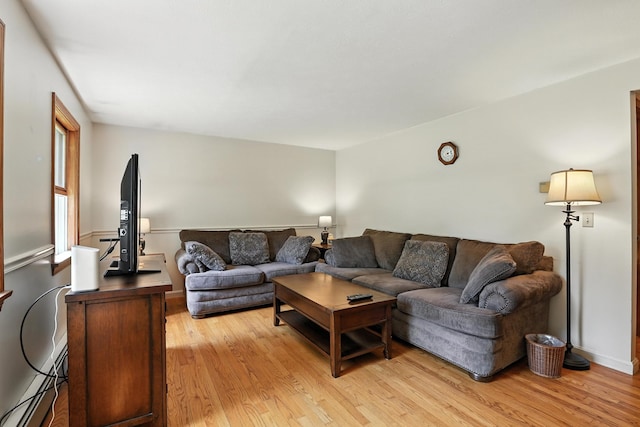 20 Edward Dr, Concord, NH 03301 - living area featuring light wood-type flooring and a baseboard heating unit