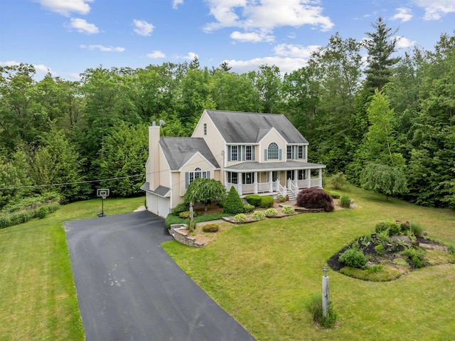 60 Lady Slipper Ln, Chester, NH 03036 - colonial house with covered porch, an attached garage, driveway, a chimney, and a view of trees