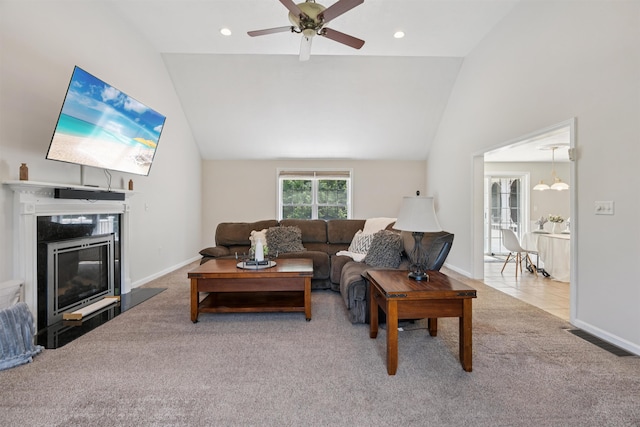 60 Lady Slipper Ln, Chester, NH 03036 - living room with carpet flooring, a glass covered fireplace, a ceiling fan, high vaulted ceiling, and recessed lighting