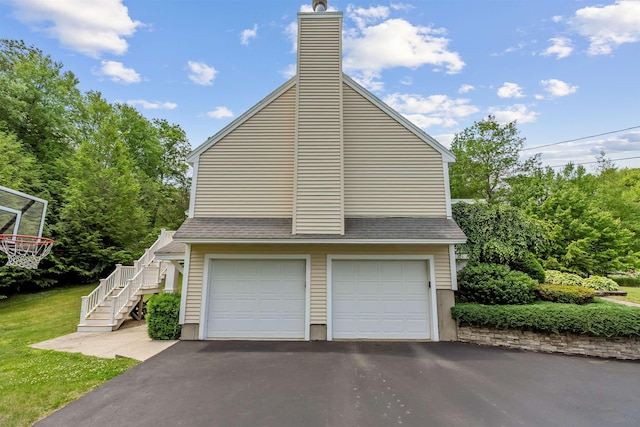 60 Lady Slipper Ln, Chester, NH 03036 - view of side of property featuring stairway, roof with shingles, a chimney, and driveway
