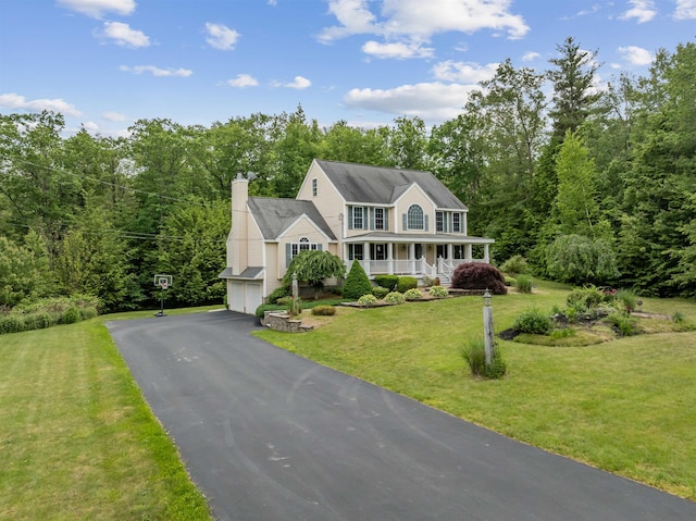 60 Lady Slipper Ln, Chester, NH 03036 - colonial home featuring a porch, an attached garage, a front yard, asphalt driveway, and a chimney