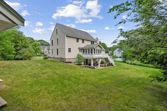 60 Lady Slipper Ln, Chester, NH 03036 - back of property featuring stairs, a wooden deck, a yard, a patio area, and a chimney
