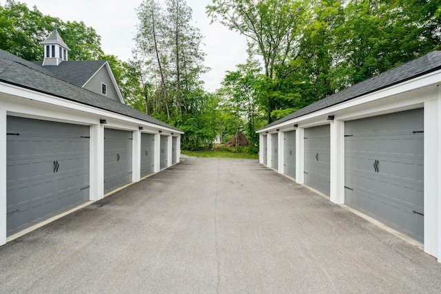 56 Maple St Unit C, Hopkinton, NH 03229 - garage featuring view of scattered trees