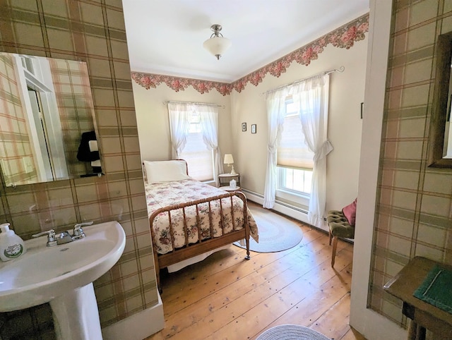 1573 US Route 5 S, Barnet, VT 05821 - bedroom featuring light wood-type flooring and a baseboard heating unit