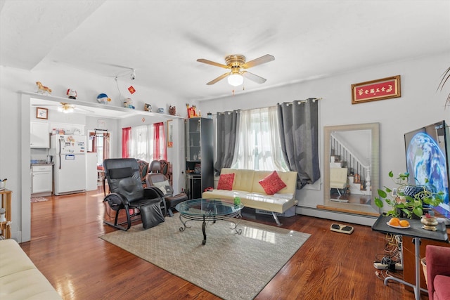 2 Brown Rd, Windham, NH 03087 - living area featuring a ceiling fan, a baseboard heating unit, plenty of natural light, and stairs