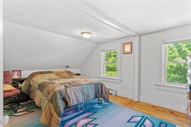 2 Brown Rd, Windham, NH 03087 - bedroom with a baseboard heating unit, multiple windows, wood finished floors, and lofted ceiling