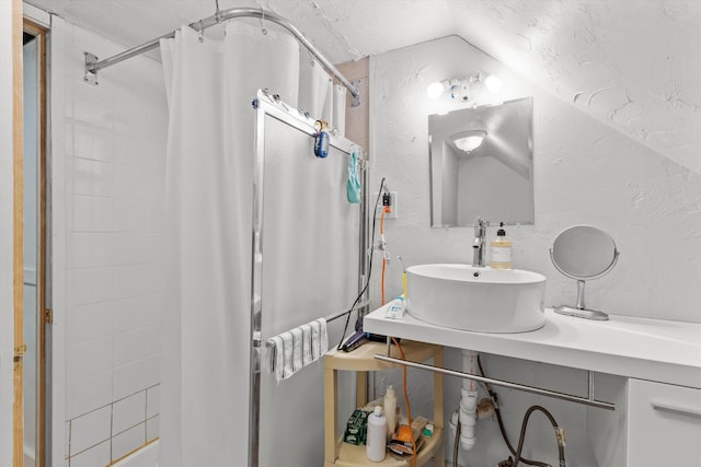 2 Brown Rd, Windham, NH 03087 - bathroom with vaulted ceiling, vanity, and a textured wall
