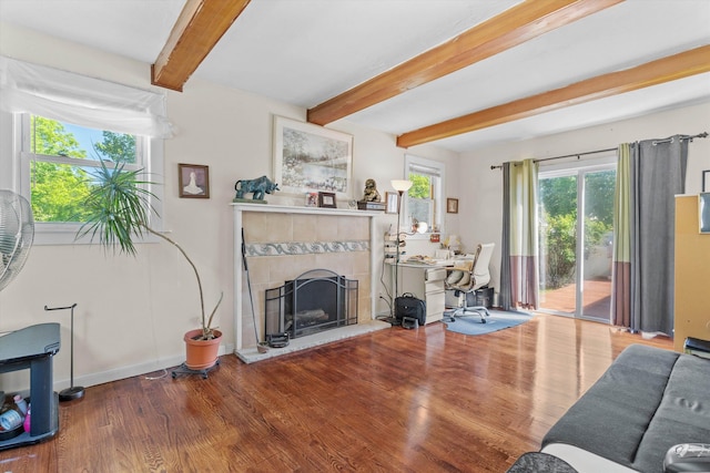 2 Brown Rd, Windham, NH 03087 - living room with beamed ceiling, wood finished floors, a desk, and a fireplace