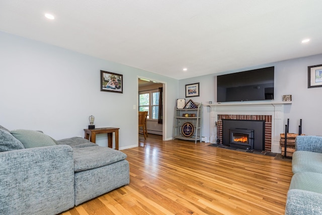 19 Harding Rd, Portsmouth, NH 03801 - living area with light wood-style flooring, a baseboard radiator, a fireplace, and recessed lighting