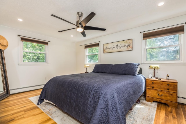 19 Harding Rd, Portsmouth, NH 03801 - bedroom featuring baseboard heating, light wood finished floors, recessed lighting, and ceiling fan