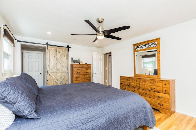 19 Harding Rd, Portsmouth, NH 03801 - bedroom featuring wood finished floors, a barn door, ceiling fan, and recessed lighting