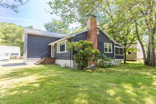 19 Harding Rd, Portsmouth, NH 03801 - view of side of home featuring a chimney and a yard