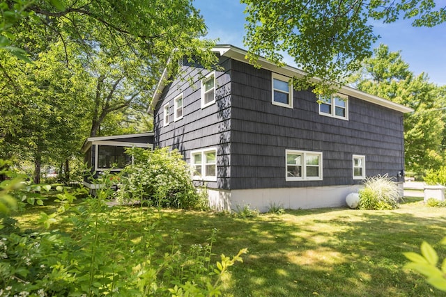 19 Harding Rd, Portsmouth, NH 03801 - view of home's exterior with a yard and a sunroom