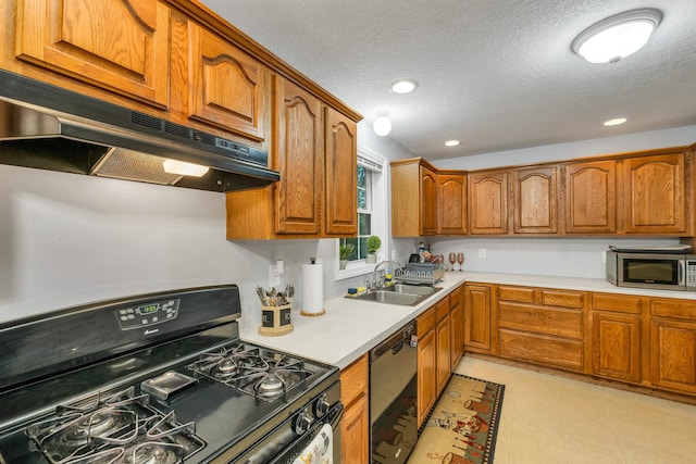 69A Windham Rd Unit A, Hudson, NH 03051 - kitchen featuring black gas range oven, dishwashing machine, stainless steel microwave, under cabinet range hood, and brown cabinetry