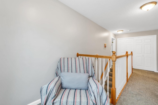 69A Windham Rd Unit A, Hudson, NH 03051 - corridor with carpet flooring and an upstairs landing