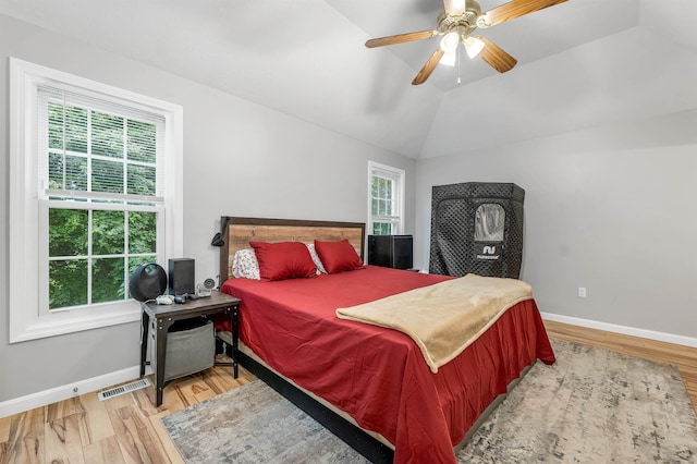 69A Windham Rd Unit A, Hudson, NH 03051 - bedroom featuring wood finished floors, multiple windows, lofted ceiling, and a ceiling fan