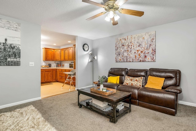 69A Windham Rd Unit A, Hudson, NH 03051 - living area with light carpet, a ceiling fan, recessed lighting, and a textured ceiling