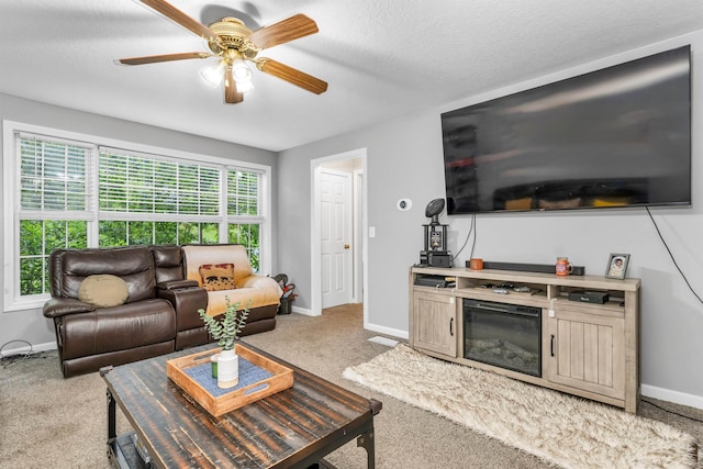 69A Windham Rd Unit A, Hudson, NH 03051 - living area featuring carpet floors, a ceiling fan, and a textured ceiling