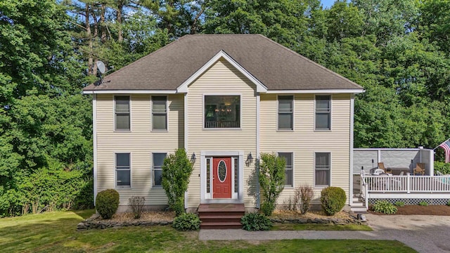 12 Lawrence St, Derry, NH 03038 - view of front facade with a front yard and a wooden deck