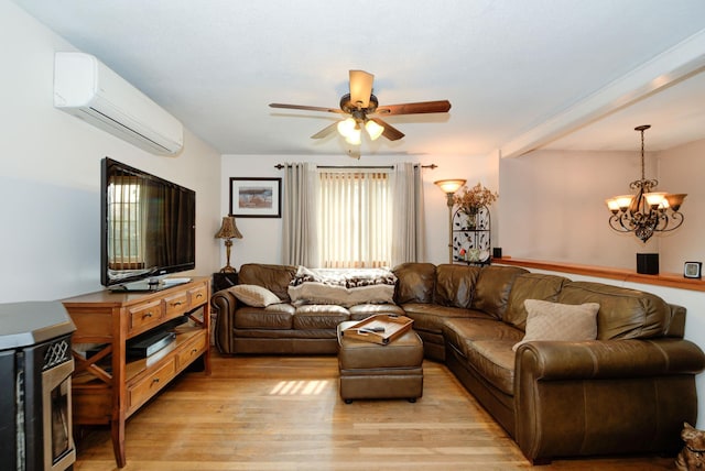 27 Meisner Rd, Salem, NH 03079 - living area with a wall unit AC, light wood-type flooring, a chandelier, and a ceiling fan