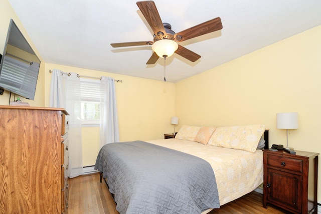 27 Meisner Rd, Salem, NH 03079 - bedroom featuring wood finished floors, a ceiling fan, and a baseboard heating unit