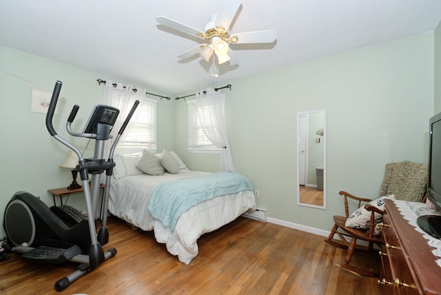 27 Meisner Rd, Salem, NH 03079 - bedroom with wood finished floors, baseboard heating, and a ceiling fan