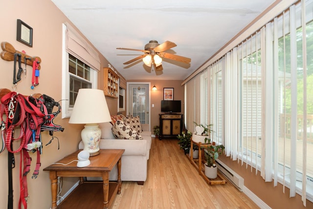 27 Meisner Rd, Salem, NH 03079 - living area featuring light wood-style floors, ceiling fan, and a baseboard radiator