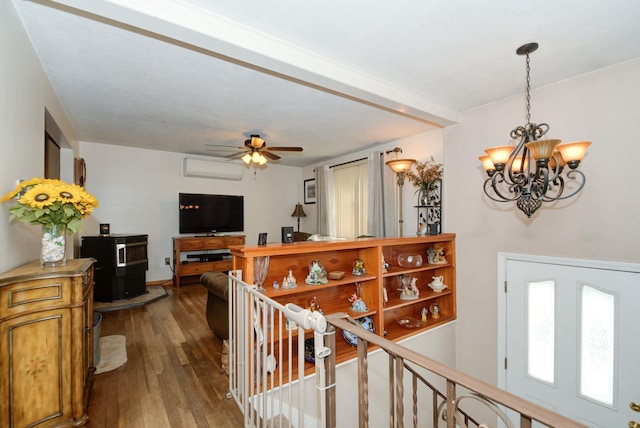27 Meisner Rd, Salem, NH 03079 - corridor featuring dark wood-style flooring, a wall mounted AC, a chandelier, and an upstairs landing