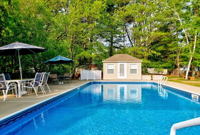 27 Meisner Rd, Salem, NH 03079 - view of pool with an outbuilding, a patio area, a storage structure, and view of scattered trees