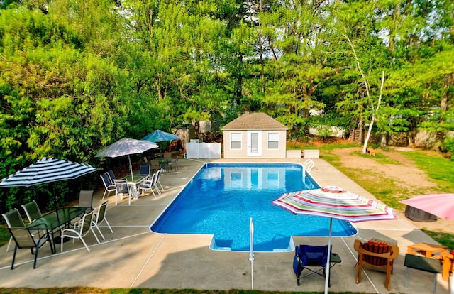 27 Meisner Rd, Salem, NH 03079 - outdoor pool featuring a patio area, an outbuilding, view of wooded area, and an exterior structure