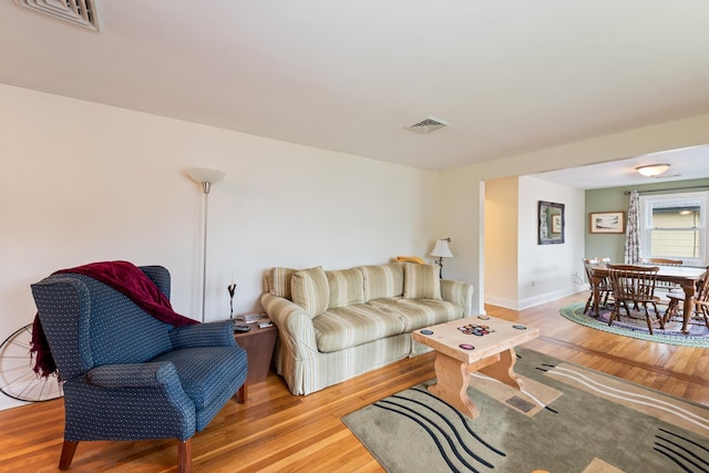 10 Prospect St, Bristol, NH 03222 - living room featuring light wood-style flooring and baseboards