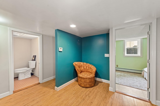 10 Prospect St, Bristol, NH 03222 - sitting room featuring a baseboard heating unit, wood finished floors, and recessed lighting
