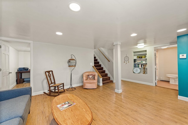 10 Prospect St, Bristol, NH 03222 - living area with stairway, recessed lighting, light wood-type flooring, a baseboard radiator, and built in shelves