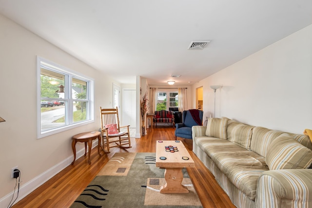 10 Prospect St, Bristol, NH 03222 - living room with wood finished floors and baseboards