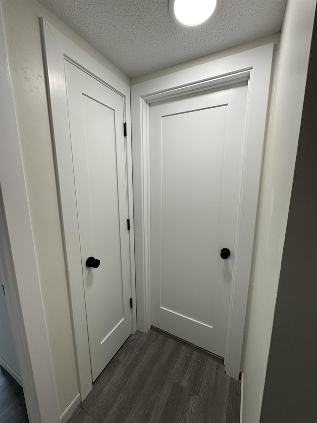 121 Cluff Xing Unit 8, Salem, NH 03079 - detailed view of wood finished floors and a textured ceiling