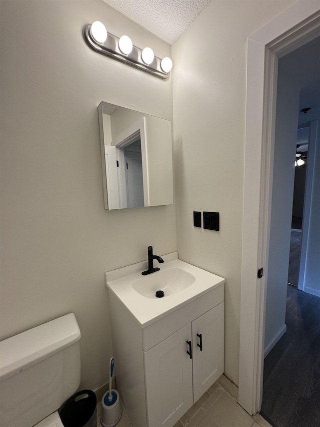 121 Cluff Xing Unit 8, Salem, NH 03079 - bathroom with vanity and a textured ceiling
