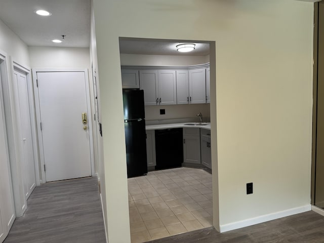 121 Cluff Xing Unit 8, Salem, NH 03079 - kitchen with black appliances, light countertops, gray cabinets, light wood-style floors, and recessed lighting