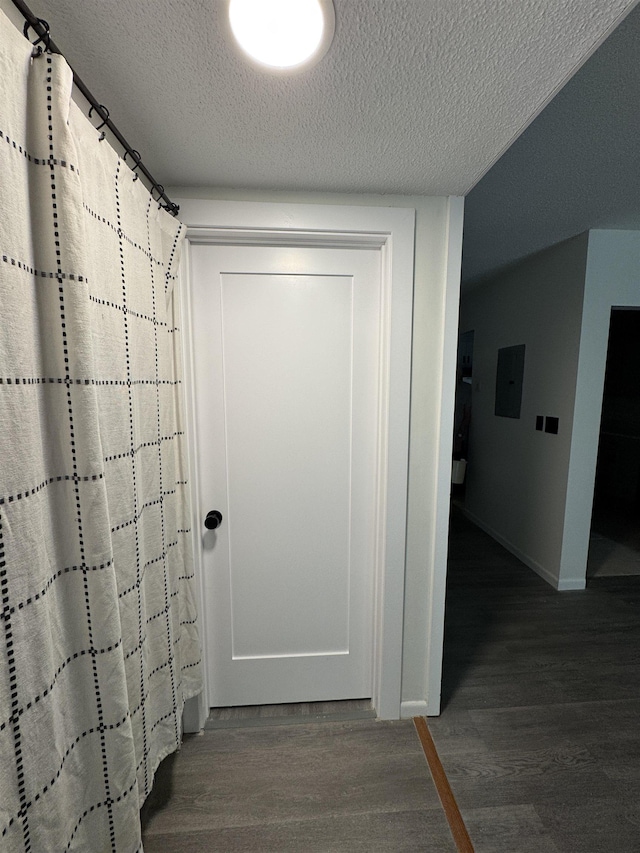 121 Cluff Xing Unit 8, Salem, NH 03079 - hallway with wood finished floors, electric panel, and a textured ceiling