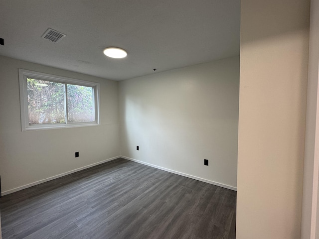 121 Cluff Xing Unit 8, Salem, NH 03079 - spare room with dark wood finished floors and baseboards