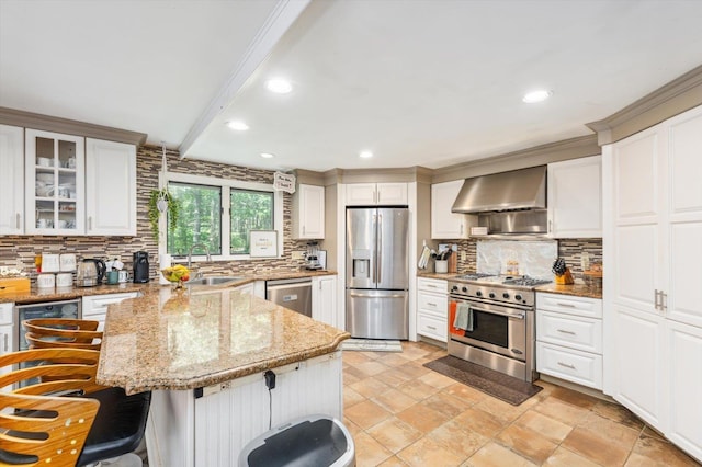 10 Cranberry Rd, Keene, NH 03431 - kitchen with appliances with stainless steel finishes, wall chimney exhaust hood, a peninsula, tasteful backsplash, and recessed lighting