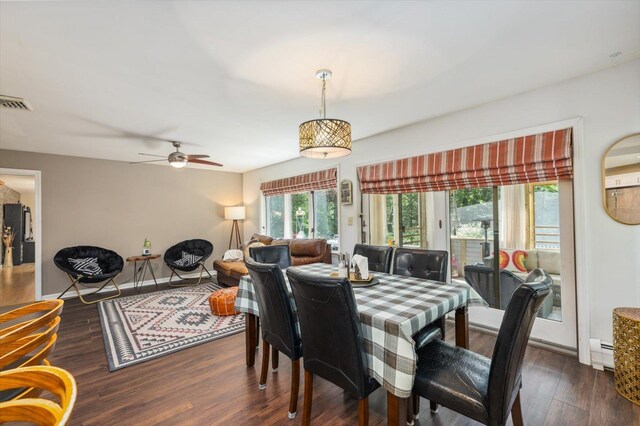 10 Cranberry Rd, Keene, NH 03431 - dining space with baseboard heating, dark wood-type flooring, and a ceiling fan