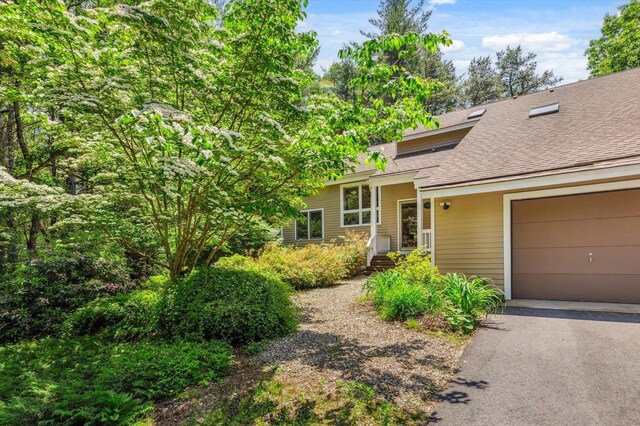 10 Cranberry Rd, Keene, NH 03431 - split level home featuring a shingled roof, driveway, and a garage