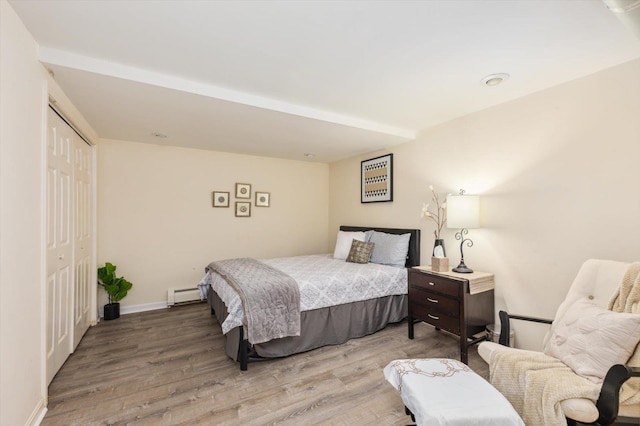 10 Cranberry Rd, Keene, NH 03431 - bedroom with wood finished floors, a closet, and a baseboard heating unit