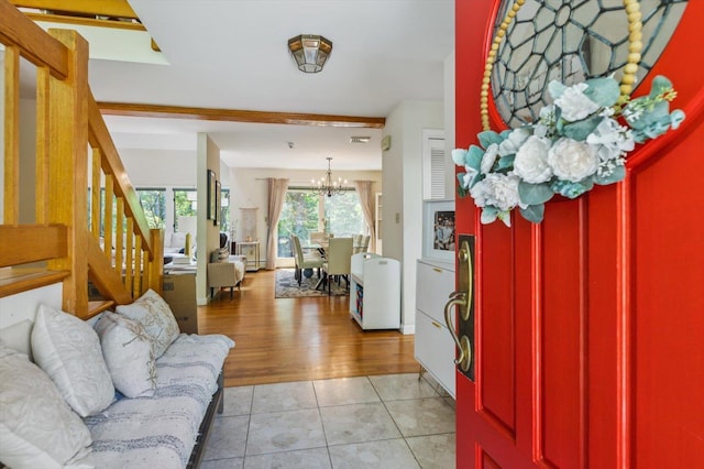 10 Cranberry Rd, Keene, NH 03431 - foyer entrance with a chandelier, stairs, and light tile patterned floors